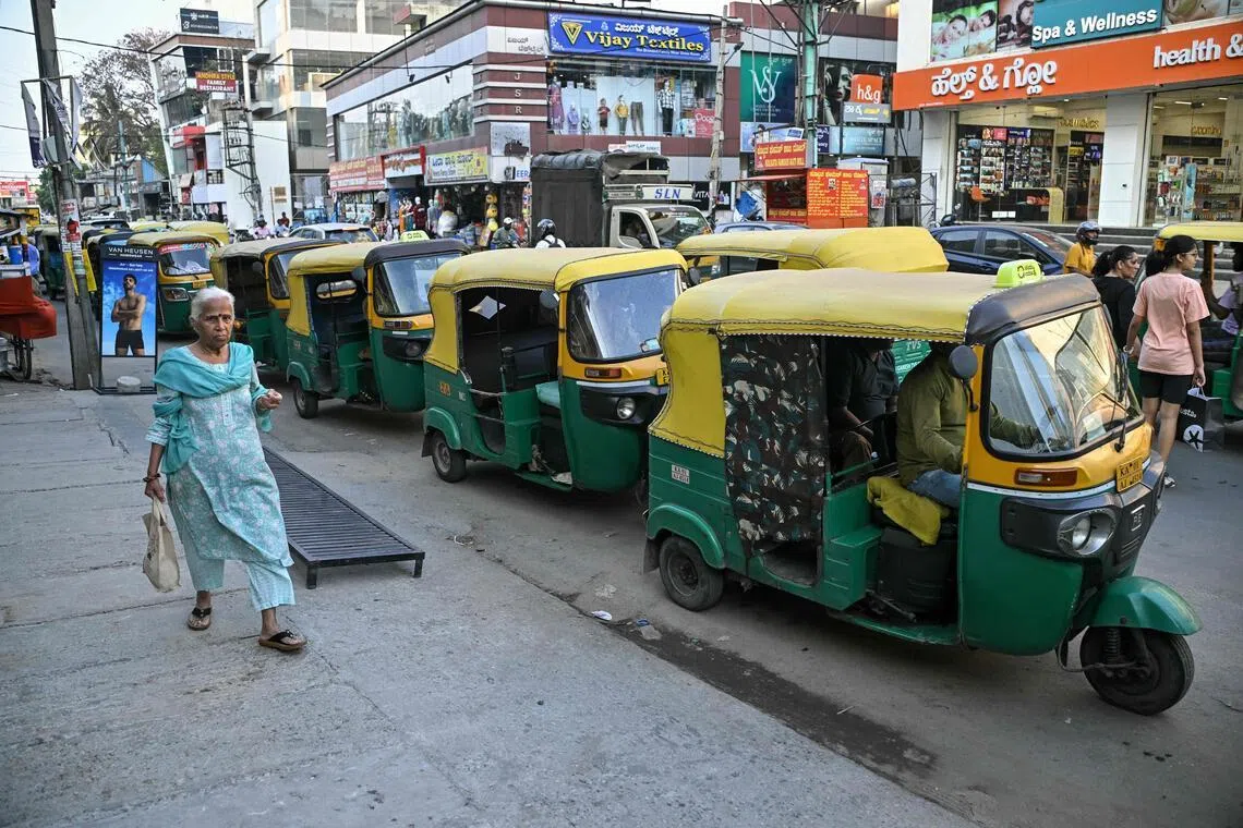 Auto-rickshaws queue to refuel at an LPG filling station in Bengaluru on April 1. India is the world’s fourth-largest buyer of liquefied natural gas (LNG) and second-largest buyer of LPG, which is used for cooking and predominantly sourced from the Middle East.