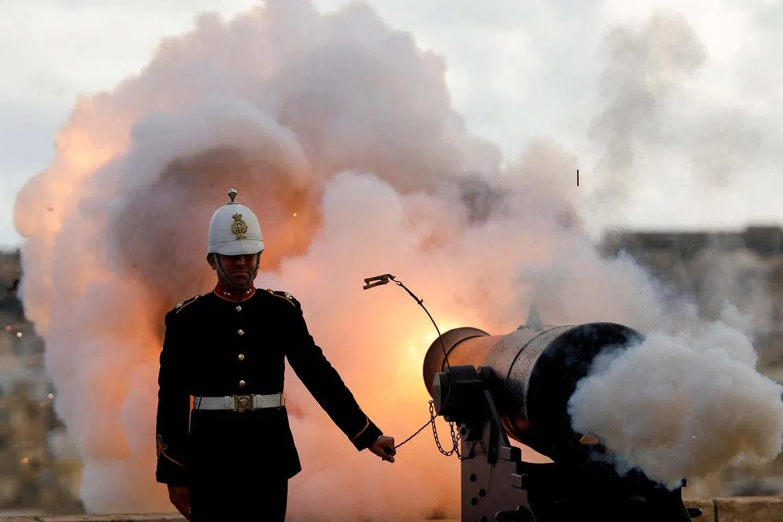 A reenactor of the Malta Heritage Trust firing a cannon during an eight-gun salute to celebrate the feast of the Shipwreck of St Paul, Malta's patron saint, in Valletta, Malta, Feb 10, 2025. 