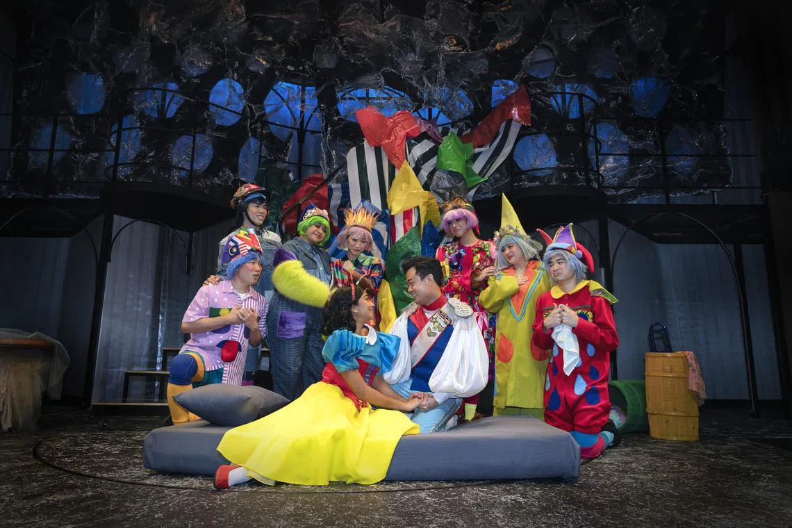 Snow White and Prince Charming (Nadya Zaheer & Vester Ng; center) share a tender moment after breaking the curse.