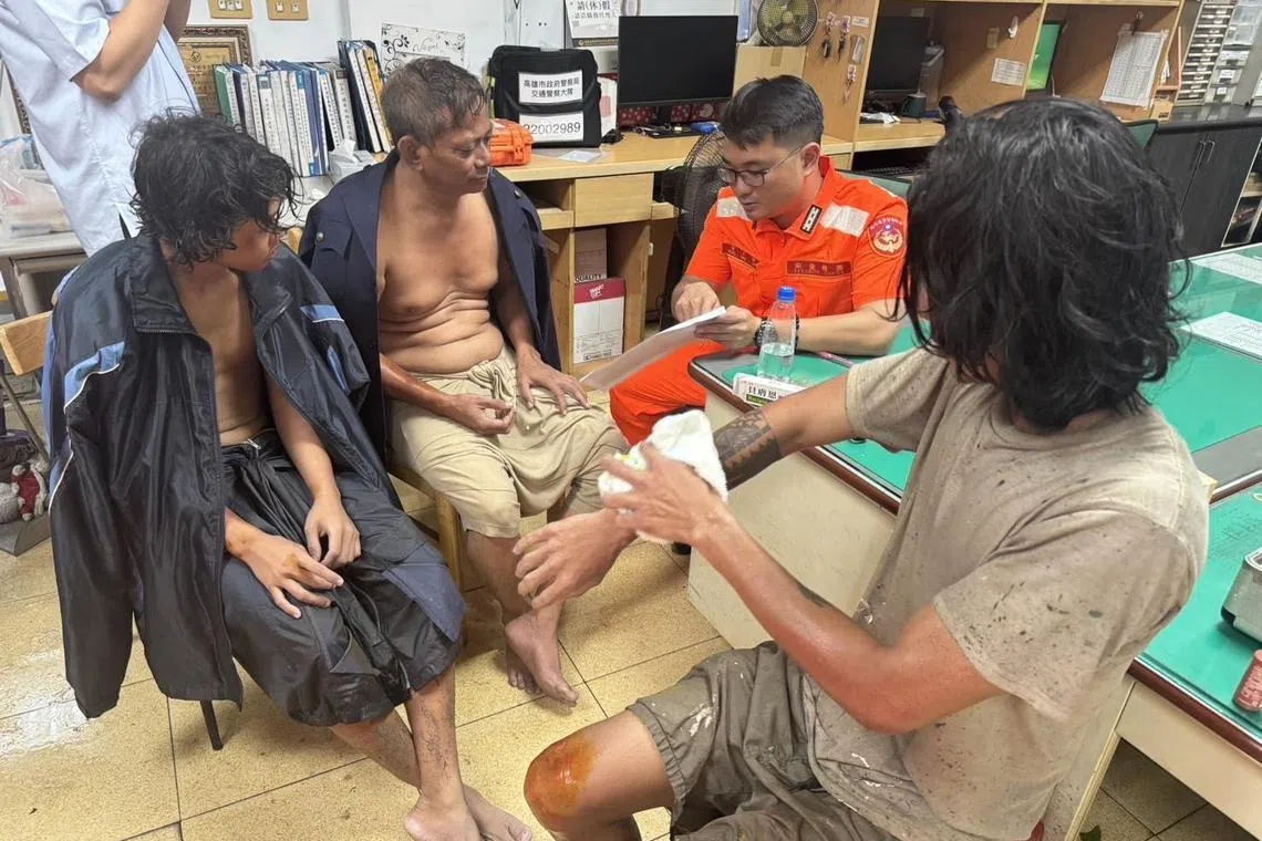 epa11496792 A handout photo made available by the Taiwan Coastguard Administration shows three crew members rescued from the sunken Tanzanian freighter, Fu Shun, at a police station in Kaohsiung, Taiwan, 25 July 2024 (issued 26 July 2024). According to the Taiwan Coastguard, two crew members from the Tanzanian freighter Fu Shun, which sank during Typhoon Gaemi, were rescued on 25 July after being found by locals on the coast. Another crew member was later found near Fengbitou in Kaohsiung. Six crew members are still missing.  EPA-EFE/Taiwan Coastguard Administration / HANDOUT  HANDOUT EDITORIAL USE ONLY/NO SALES