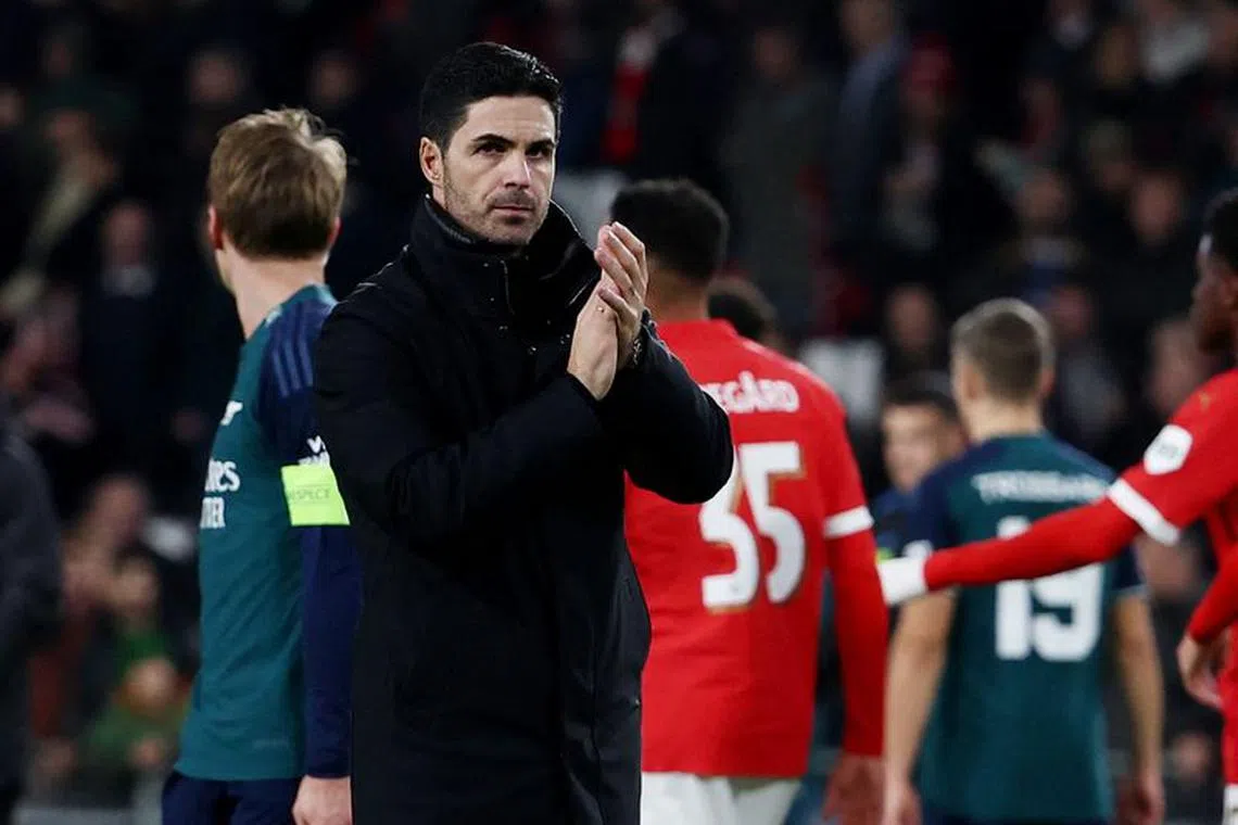 Soccer Football - Champions League - Group B - PSV Eindhoven v Arsenal - Philips Stadion, Eindhoven, Netherlands - December 12, 2023 Arsenal manager Mikel Arteta applauds fans after the match REUTERS/Yves Herman