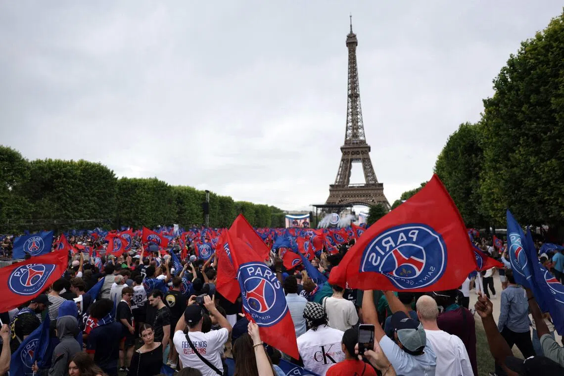 Paris Saint-Germain supporters gathering on the Champs-de-Mars during a special event organised in Paris on May 31, 2026 to celebrate PSG's victory over Arsenal during the Champions League final on May 30.