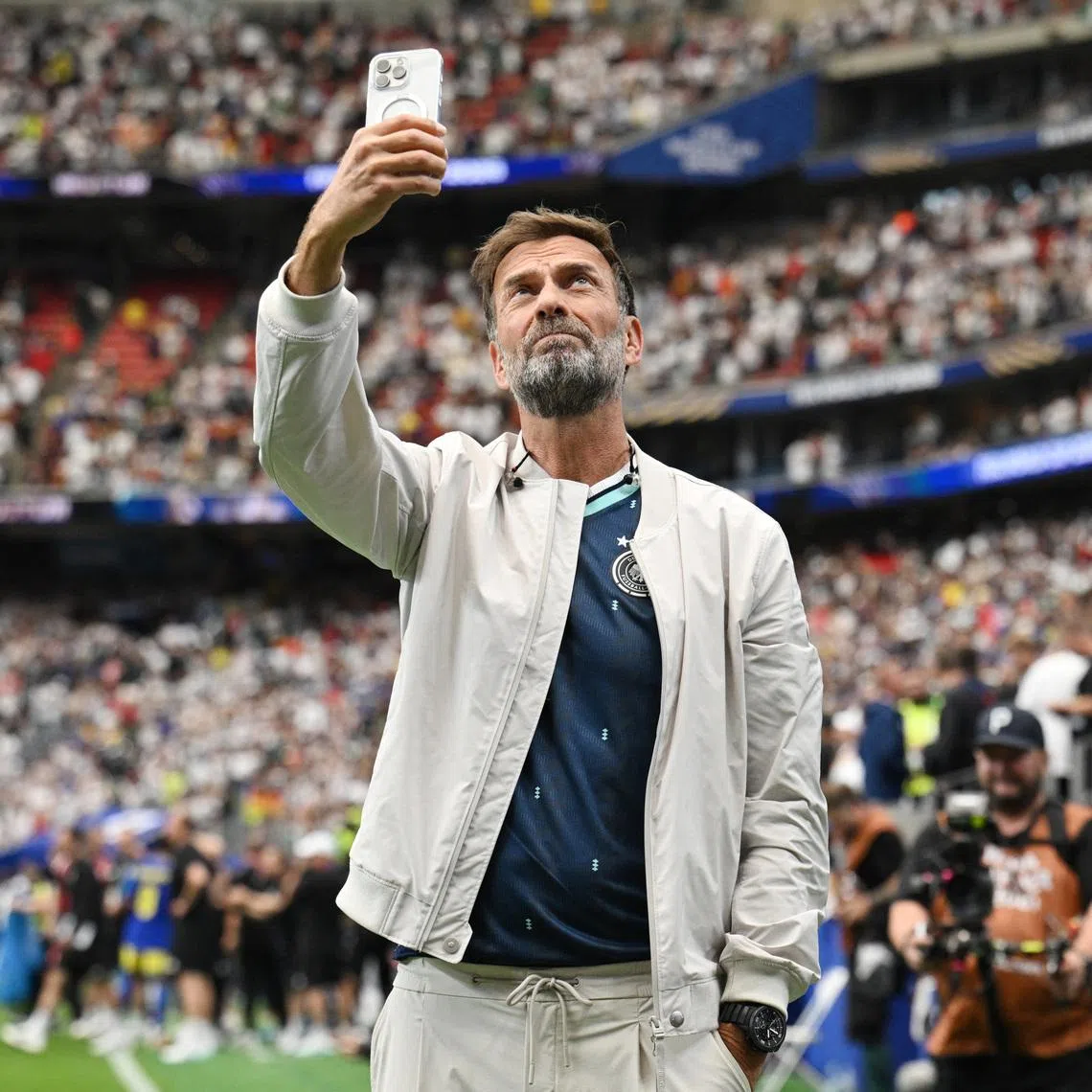 Soccer Football - FIFA World Cup 2026 - Group E - Germany v Curacao - Houston Stadium, Houston, Texas, U.S. - June 14, 2026 Red Bull's Global Head of Soccer Juergen Klopp takes a photograph inside the stadium after the match REUTERS/Annegret Hilse