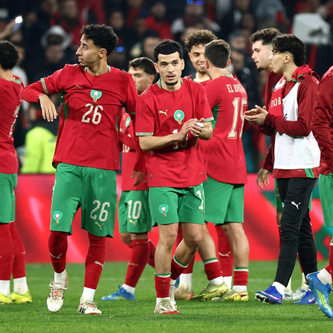 Soccer Football - International Friendly - Morocco v Paraguay - Stade Bollaert-Delelis, Lens, France - March 31, 2026  Morocco's Anass Salah-Eddine, Zakaria El Ouahdi, and teammates celebrate after the match REUTERS/Catherine Steenkeste