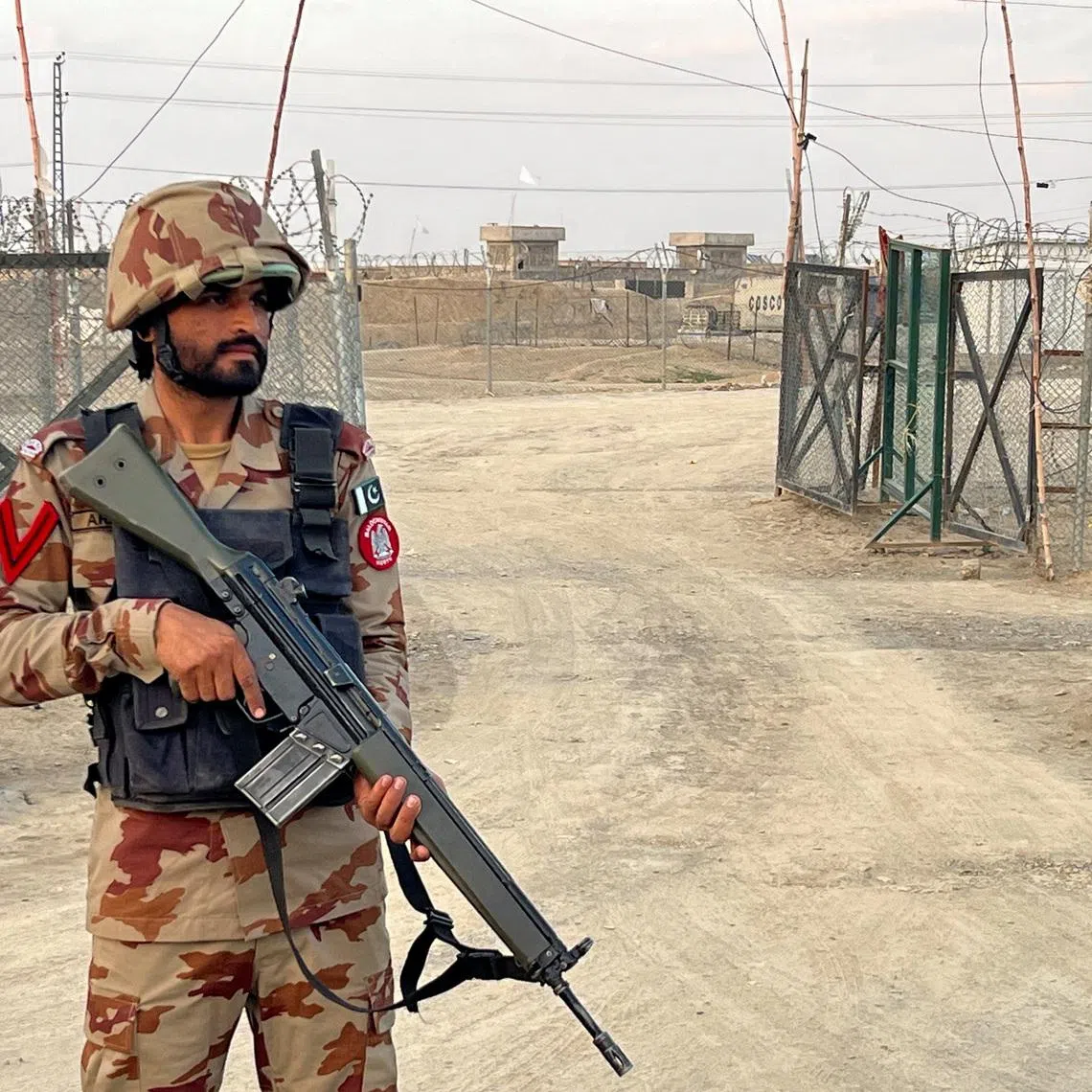 An army soldier stands guard at a deserted entry point at the Friendship Gate, following the exchanges of fire between Pakistan and Afghanistan forces, at the border crossing between the two countries, in Chaman, Pakistan February 27, 2026. REUTERS/Abdul Khaliq Achakzai