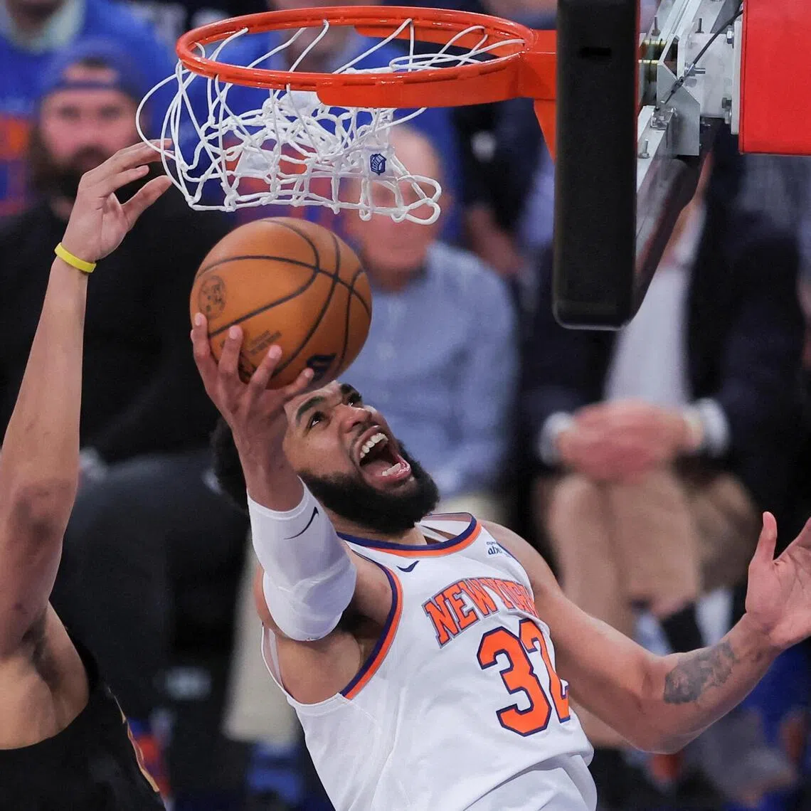 New York Knicks centre Karl-Anthony Towns shoots against Cleveland Cavaliers center Jarrett Allen during the fourth quarter of Game 1 on May 19.
