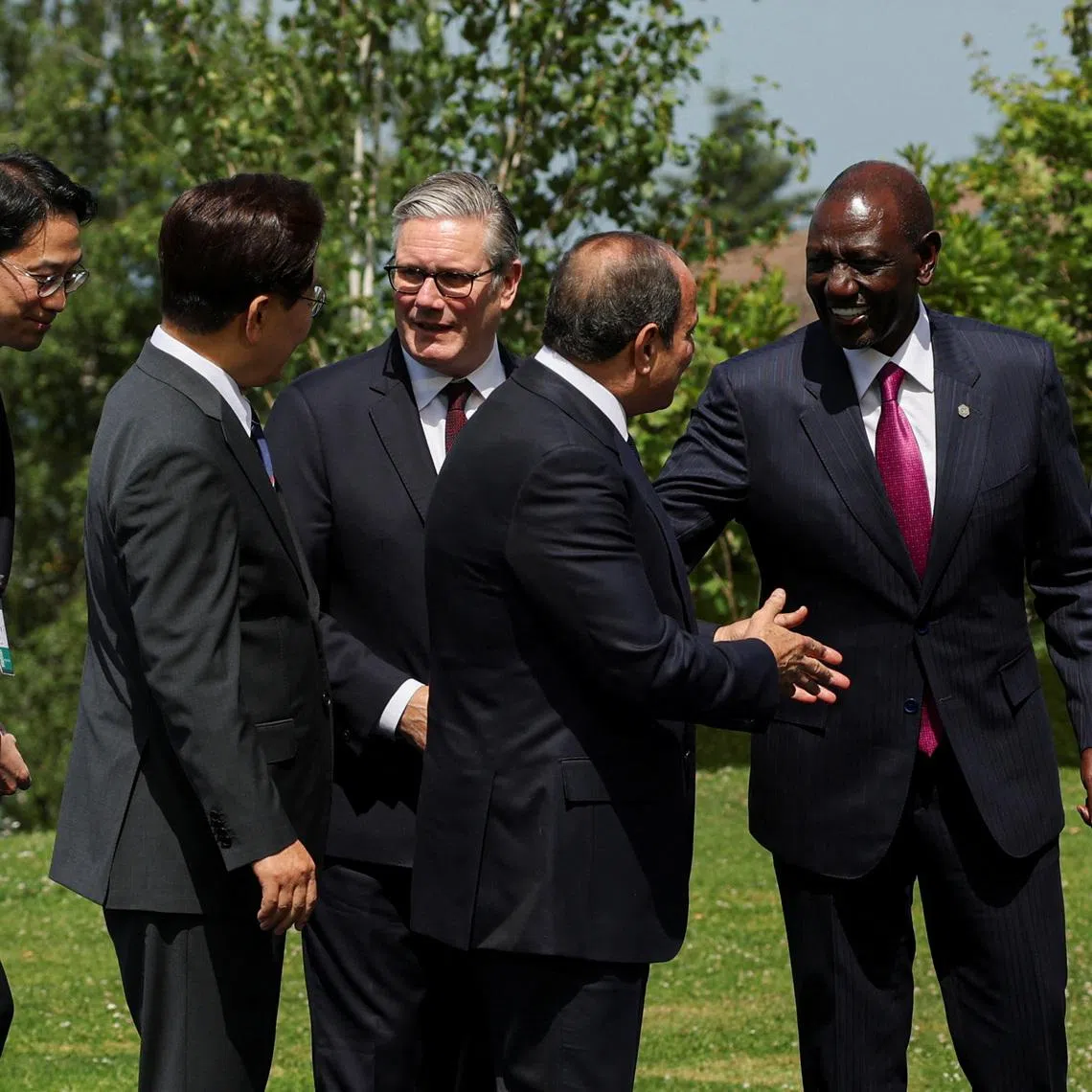 British Prime Minister Keir Starmer, South Korea's President Lee Jae Myung, Kenya's President William Ruto and Egyptian President Abdel Fattah al-Sisi, interact after posing for a family photo during the G7 summit, in Evian-les-Bains, France, June 16, 2026. REUTERS/Isabel Infantes/Pool