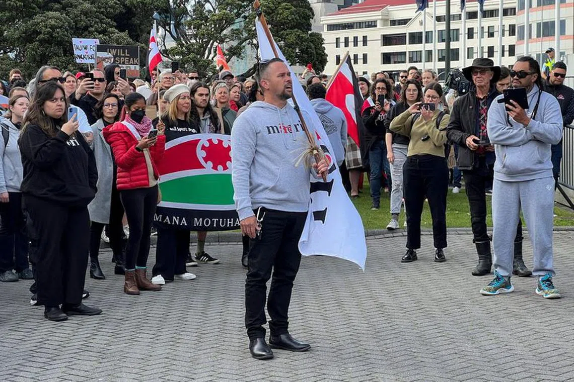 FILE PHOTO: People take part in a march led by New Zealand political party Te Pati Maori to demonstrate against the incoming government and its policies, in Wellington, New Zealand, December 5, 2023. REUTERS/Lucy Craymer/File Photo