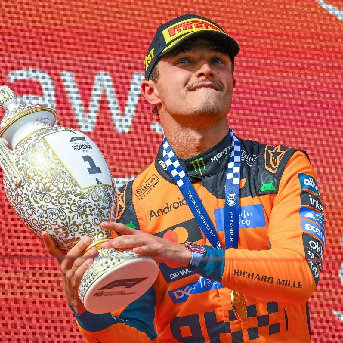 McLaren driver Lando Norris celebrating on the podium after winning the Hungarian Grand Prix on July 26.