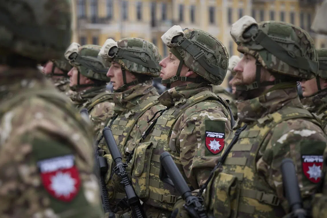 Ukrainian servicemen attending the event 'February, Year, Invincibility' on Sofiivska Square in Kyiv, Ukraine, on Feb 24.