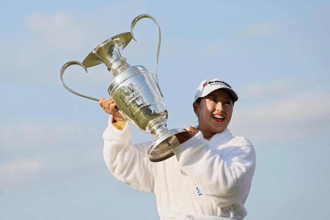 Mao Saigo of Japan posing with the trophy after winning The Chevron Championship 2025 in a play-off at The Club at Carlton Woods on April 27 at The Woodlands, Texas. 