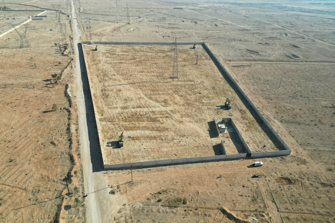 Assad government secretly moved mass grave to cover up killings, Reuters investigation finds