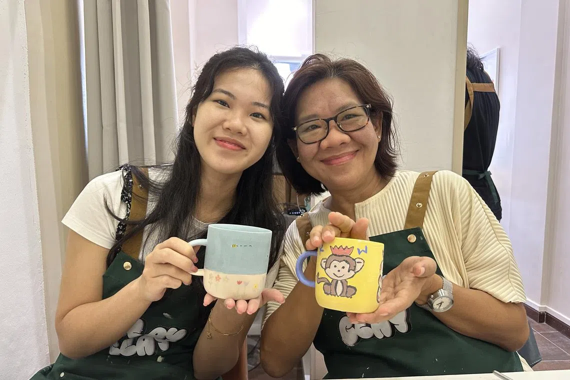 ST subscribers Ms Brenda Tan, 22 and her mother Mrs Tan, who is in her 50s, attended a clay pottery painting workshop held on Aug 18, 2024. The workshop was organised to celebrate the 179th anniversary of The Straits Times.