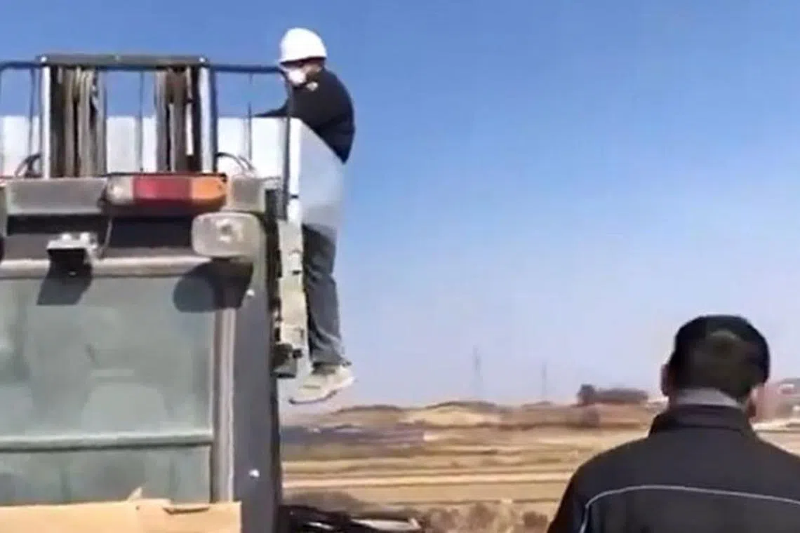 The Sri Lankan migrant worker tied to a forklift.
