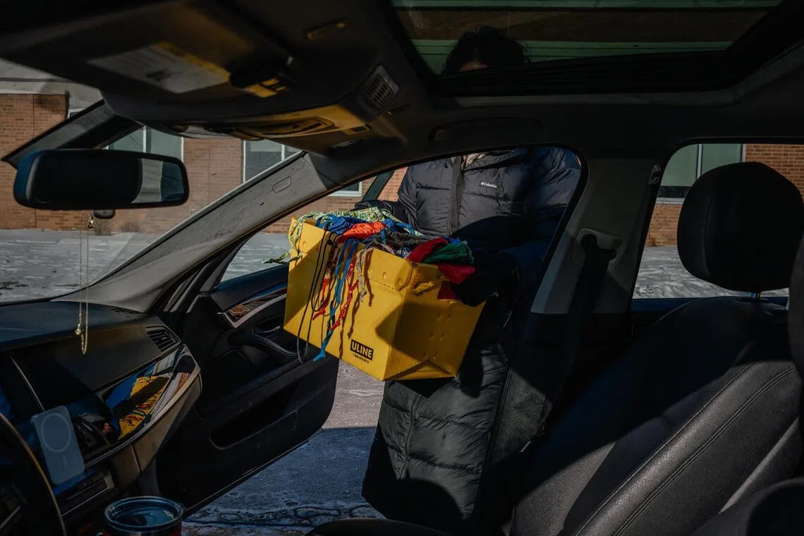 A team of social workers and staff members at Fridley Middle School in suburban Minneapolis deliver school supplies and groceries to families who are afraid to send their children to school, on Jan 28, 2026.