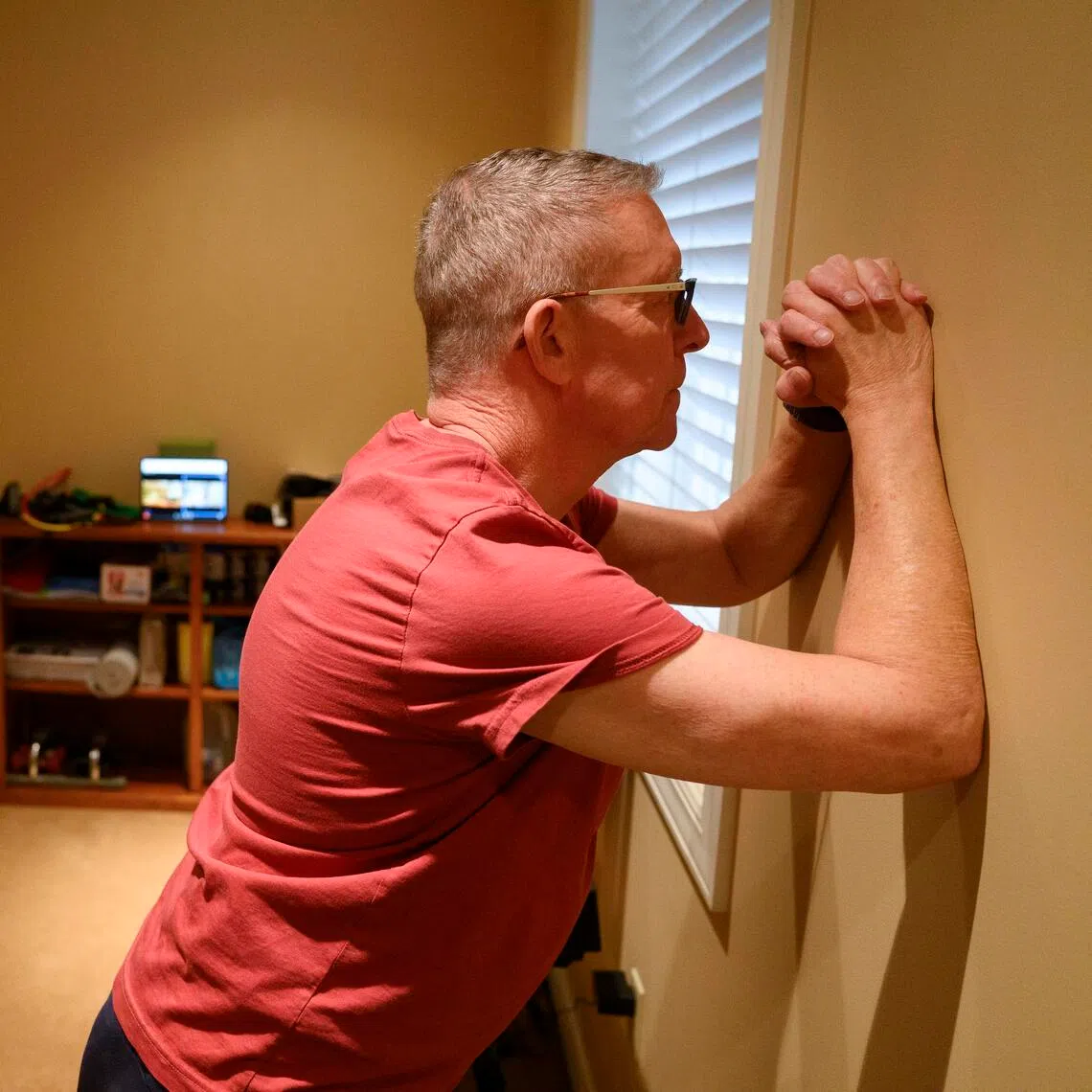 Lee Colker exercises during a virtual session with Olivia Masten, a trainer who specialises in working with cancer patients.