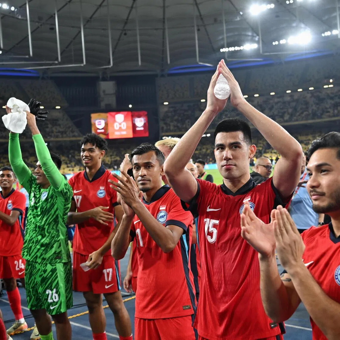 Singapore players and fans celebrating after drawing 0-0 to Malaysia and going through to the semi finals of the AFF Asean Championship at Bukit Jalil Stadium on Dec 20, 2024.