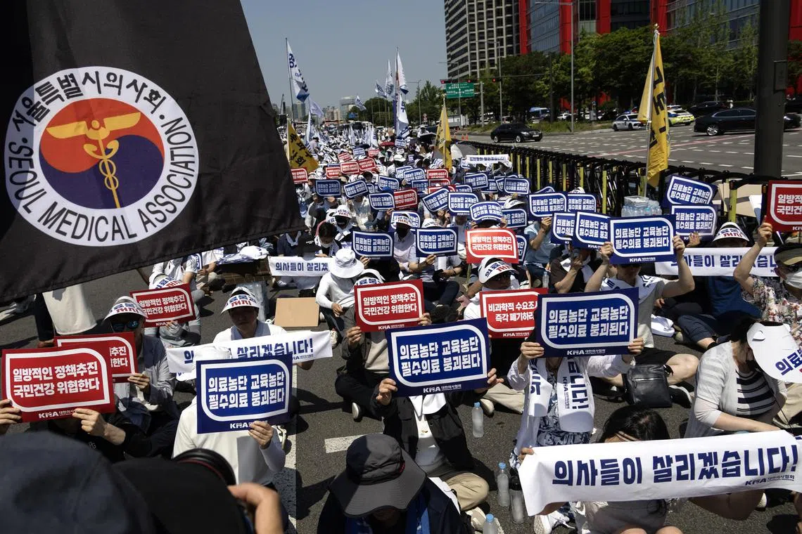 Medical professors, doctors and members of Korea Medical Association take part in a rally against the government's medical reform in Seoul, South Korea, on June 18, 2024.