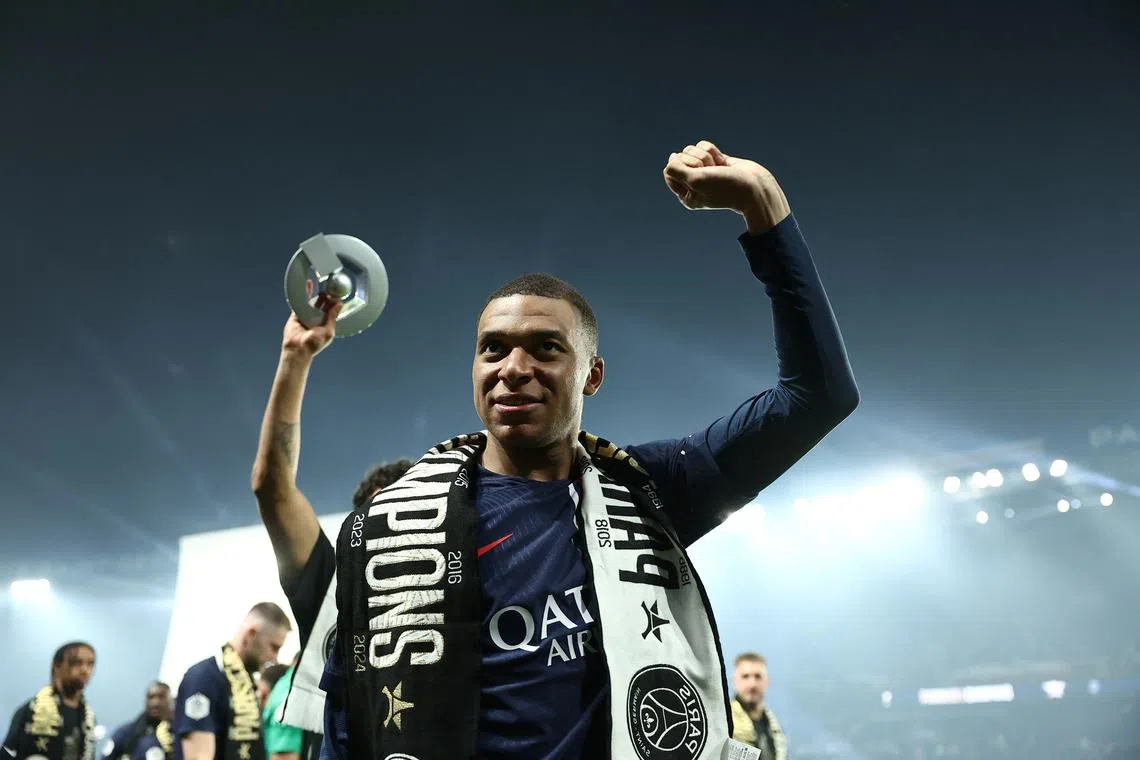 FILE PHOTO: Paris Saint-Germain's French forward Kylian Mbappe celebrates during a ceremony following the French L1 football match between Paris Saint-Germain (PSG) and Toulouse (TFC) on May 12, 2024 at the Parc des Princes stadium in Paris.     FRANCK FIFE/Pool via REUTERS