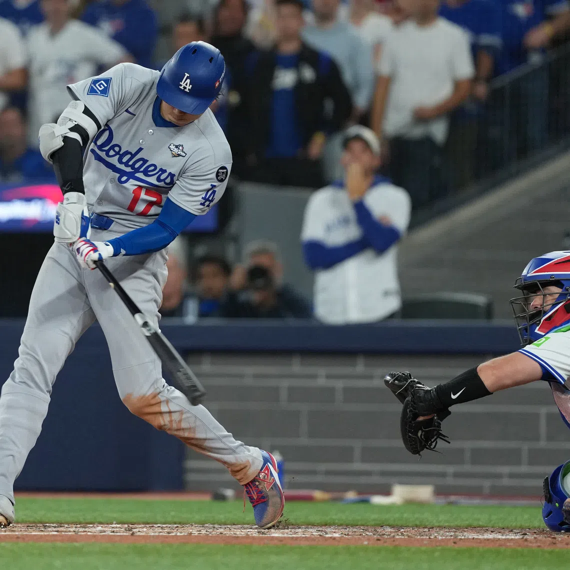Nov 1, 2025; Toronto, Ontario, CAN; Los Angeles Dodgers two-way player Shohei Ohtani (17) hits a single in the fifth inning for game seven of the 2025 MLB World Series at Rogers Centre. Mandatory Credit: Nick Turchiaro-Imagn Images