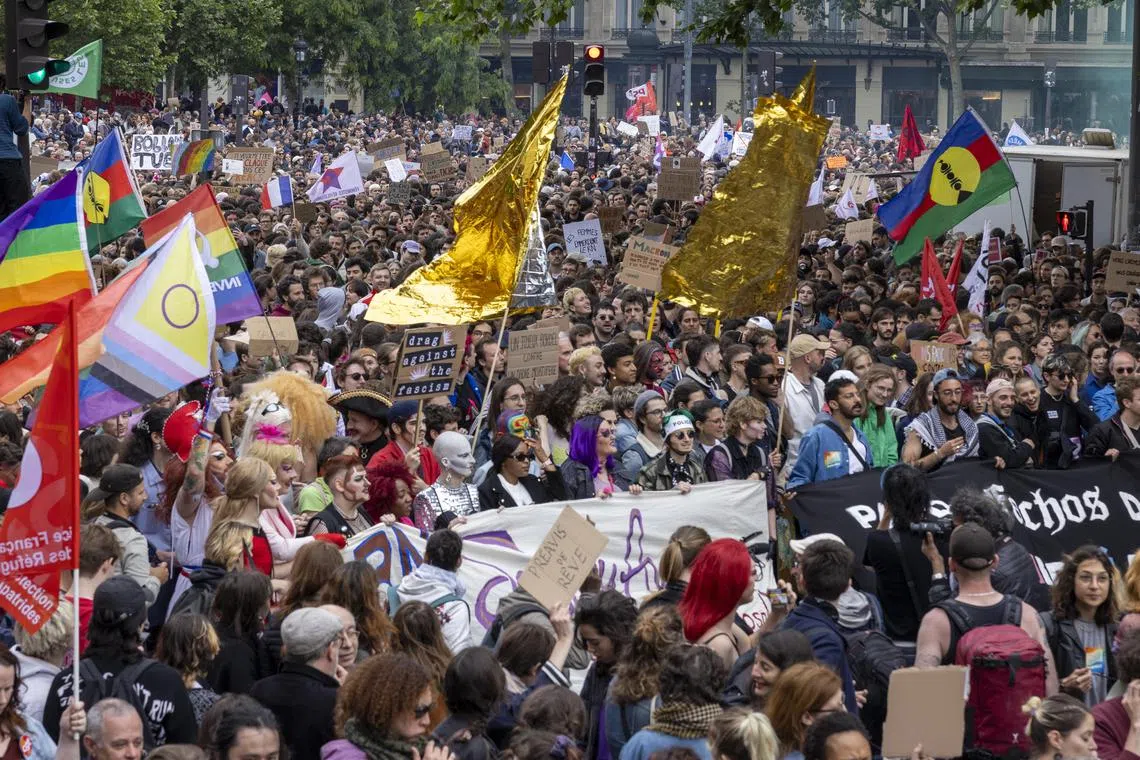 People take part in a demonstration against the French far right party National Rally (Rassemblement National or RN) following the results of the European elections, in Paris.