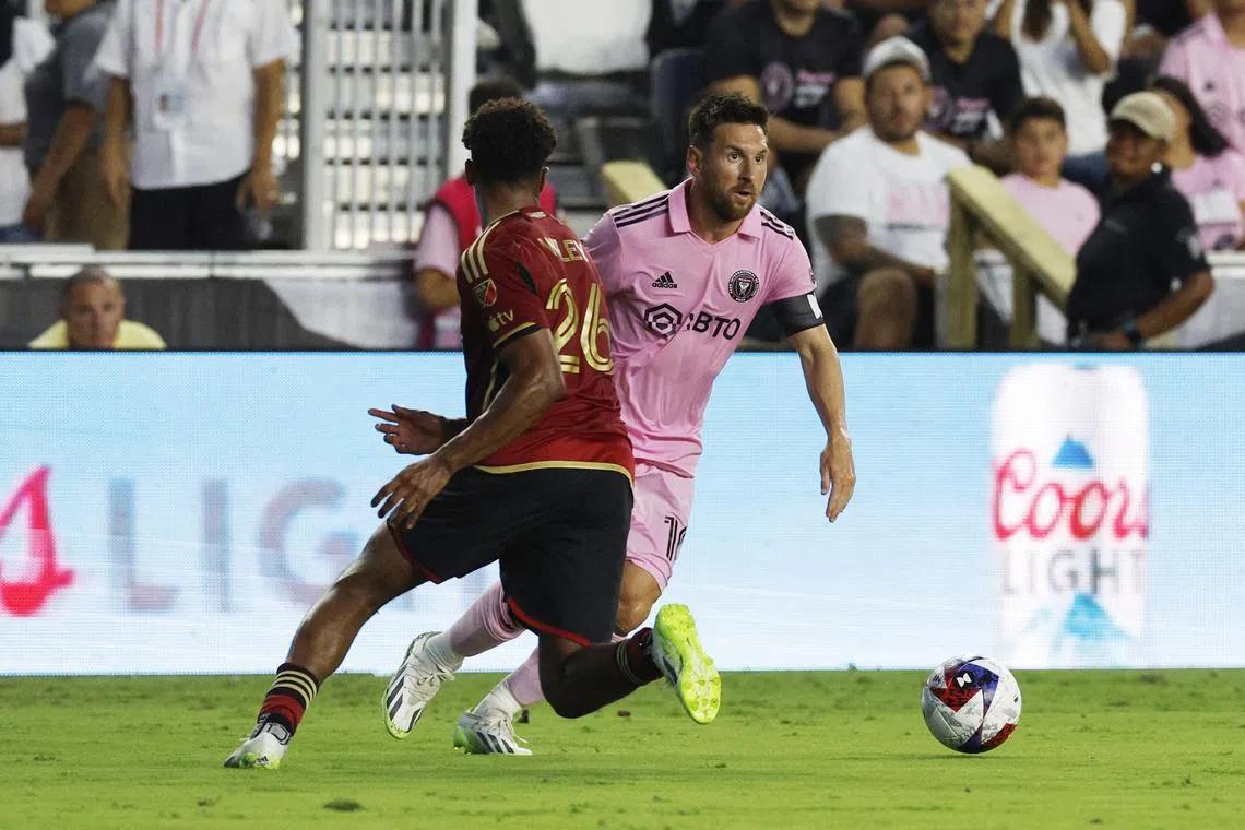 FILE PHOTO: Soccer Football - Leagues Cup - Group J - Inter Miami v Atlanta United - DRV PNK Stadium, Fort Lauderdale, Florida, United States - July 25, 2023 Inter Miami's Lionel Messi in action with Atlanta United's Caleb Wiley REUTERS/Marco Bello/File Photo