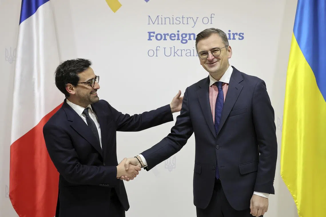Ukrainian Foreign Affairs Minister Dmytro Kuleba (right) praised his French counterpart's visit amid overnight Russian strikes on the country.