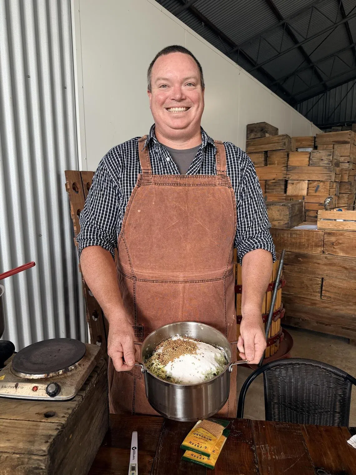 Chef and customer Ryan Edwards pickles mature zucchini to extend its shelf life at Gully Gardens Barossa.