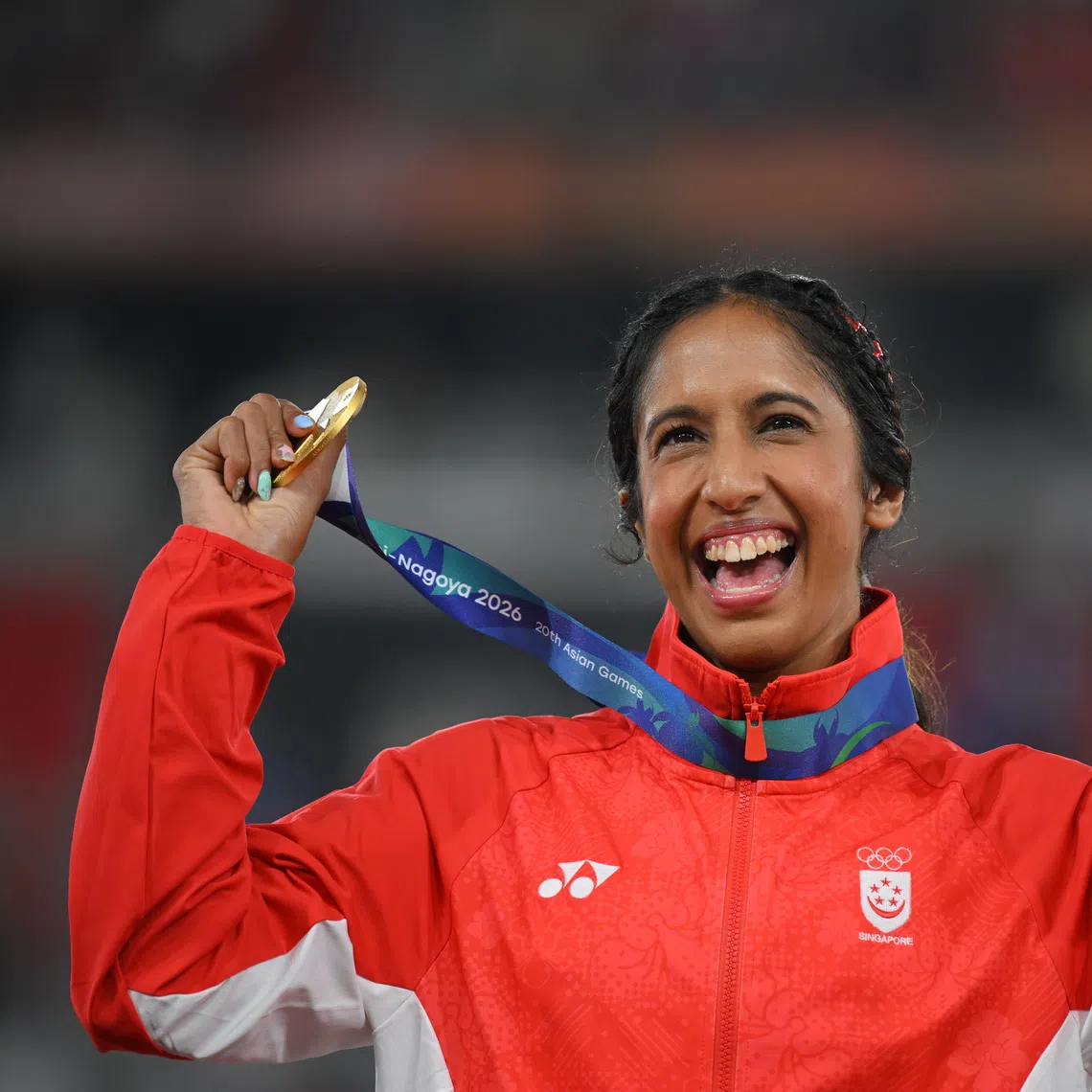 Singapore sprinter Shanti Pereira with her gold medal from the Asian Games women’s 200m final on Sept 28.