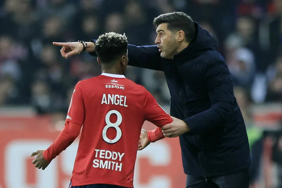 FILE PHOTO: Soccer Football - Ligue 1 - Lille v Paris St Germain - Stade Pierre-Mauroy, Villeneuve-d'Ascq, France - December 17, 2023 Lille coach Paulo Fonseca with Angel Gomes REUTERS/Pascal Rossignol/File photo