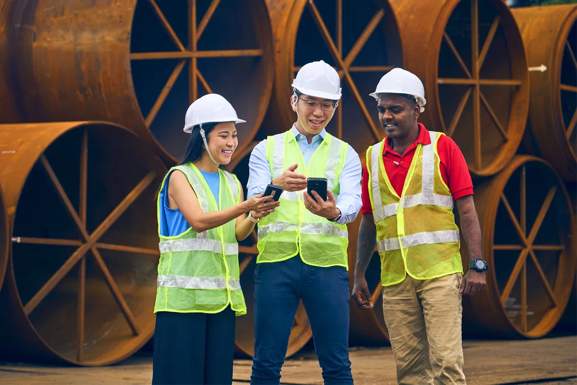 Chairman and chief executive officer Eric Leong (centre, pictured with wife Sarah Siew, who is chief of staff, and yard personnel, Mathavan Subramani) built Mlion Corporation from $100,000 in 2011 to a multimillion-dollar steel distributor operating across nine markets. 