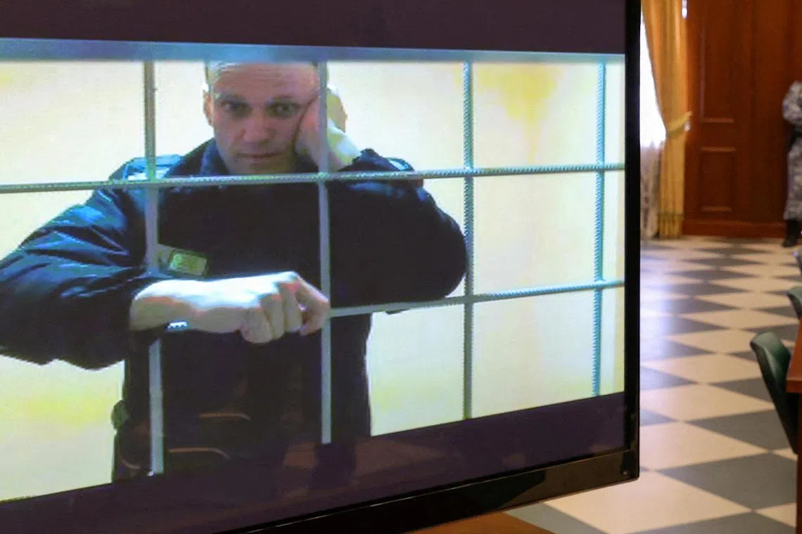 FILE PHOTO: Russian opposition leader Alexei Navalny is seen on a screen via a video link from the IK-2 corrective penal colony in Pokrov during a court hearing to consider an appeal against his prison sentence in Moscow, Russia May 24, 2022. REUTERS/Evgenia Novozhenina/File Photo/