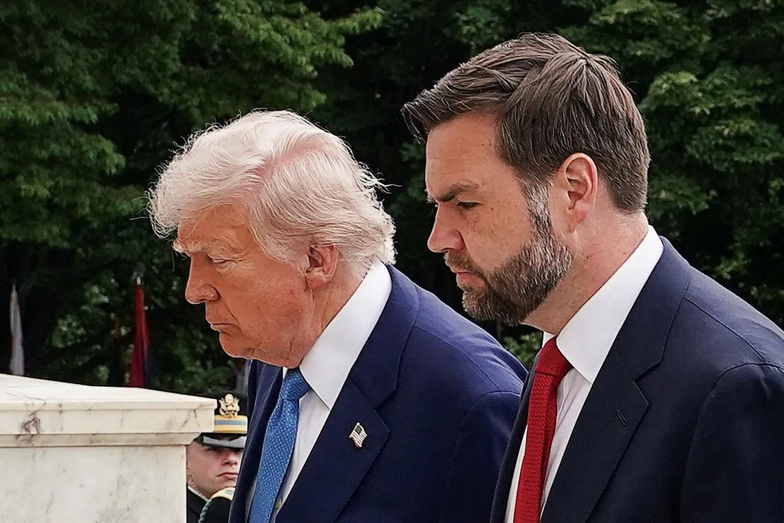 FILE PHOTO: U.S. President Donald Trump and Vice President JD Vance take part in ceremonies in commemoration of the Memorial Day holiday, at Arlington National Cemetery in Arlington, Virginia, U.S., May 26, 2025. REUTERS/Ken Cedeno/File Photo