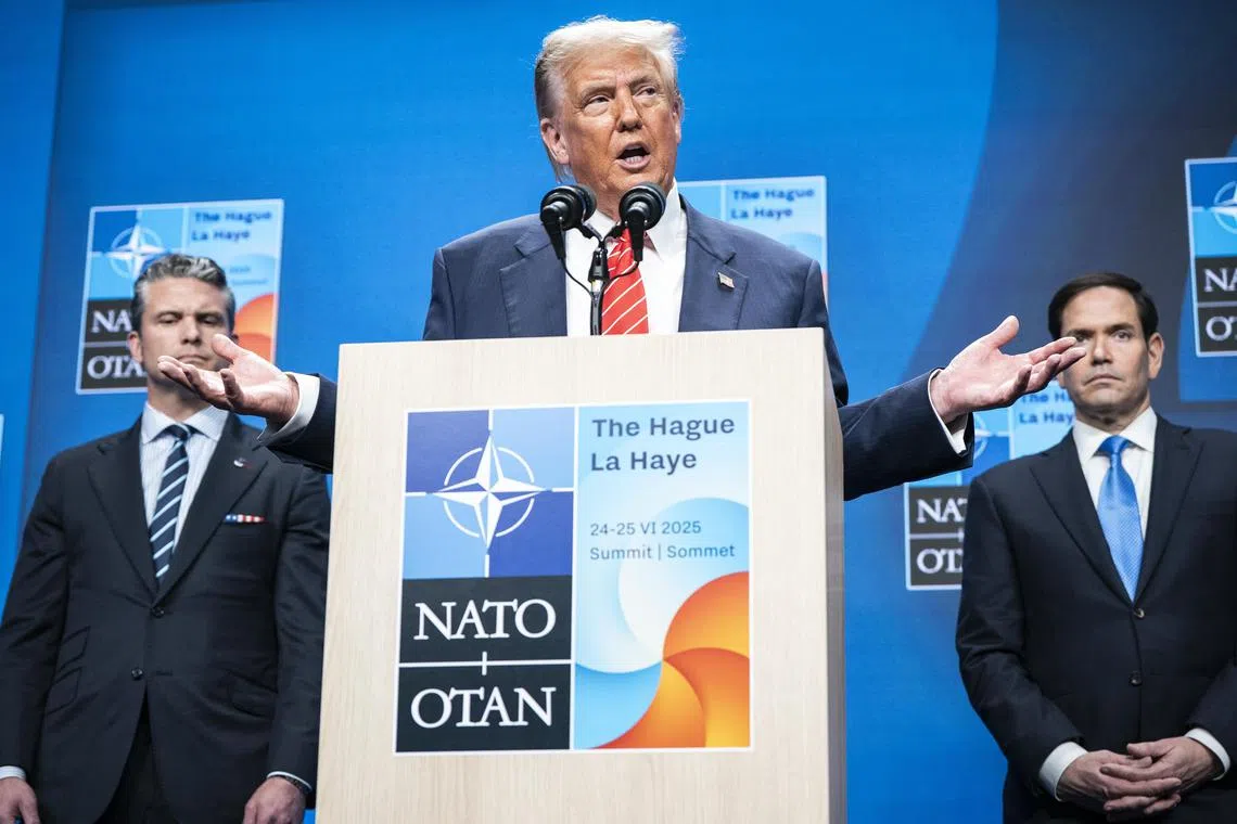 US President Donald Trump speaking during a Nato  summit news conference in the  Netherlands, on June 25, with Defence Secretary Pete Hegseth (left) and Secretary of State Marco Rubio.