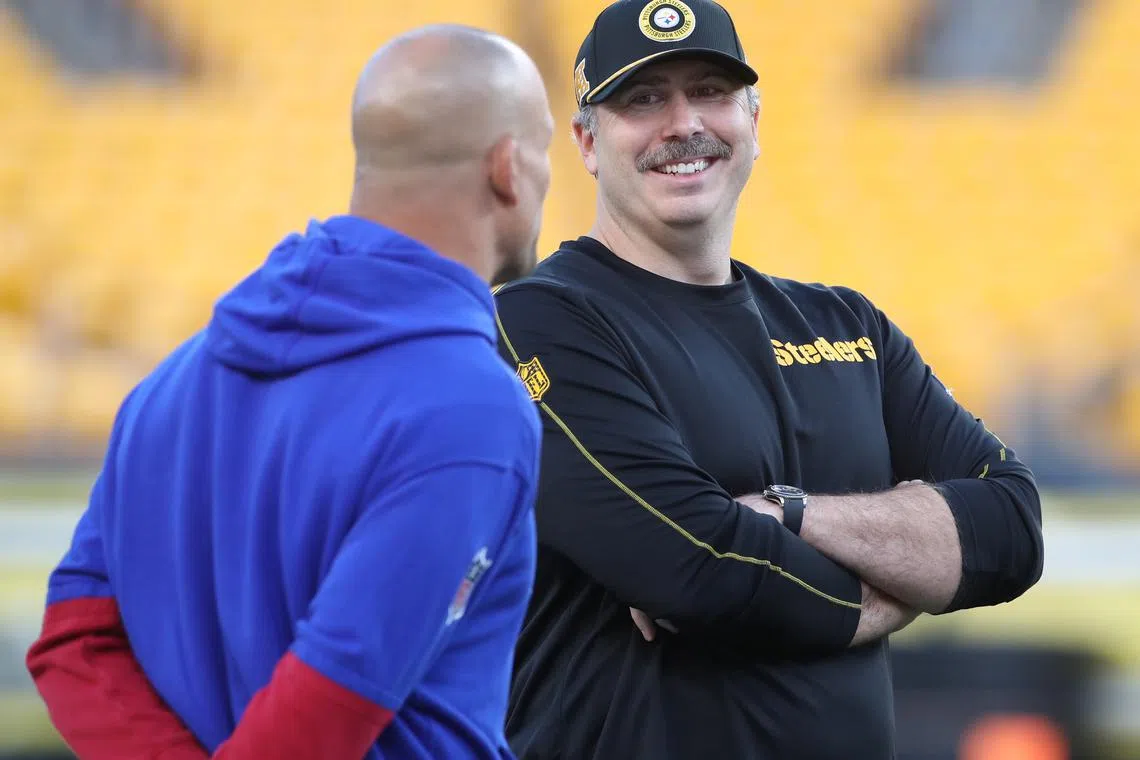 Oct 28, 2024; Pittsburgh, Pennsylvania, USA;  New York Giants offensive coordinator Mike Kafka (left) and Pittsburgh Steelers offensive coordinator Arthur Smith (right) talk on the field before their teams play at Acrisure Stadium. Mandatory Credit: Charles LeClaire-Imagn Images/ File Photo