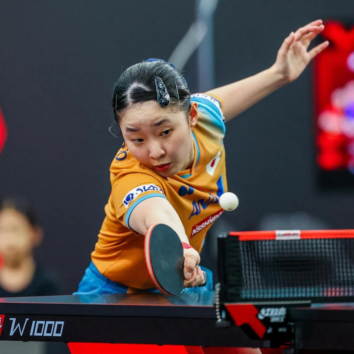 Japan's 17-year-old Miwa Harimoto chalks up wins in the women's singles last 16 and women's doubles  semi-finals with compatriot Hina Hayata at the Singapore Smash.