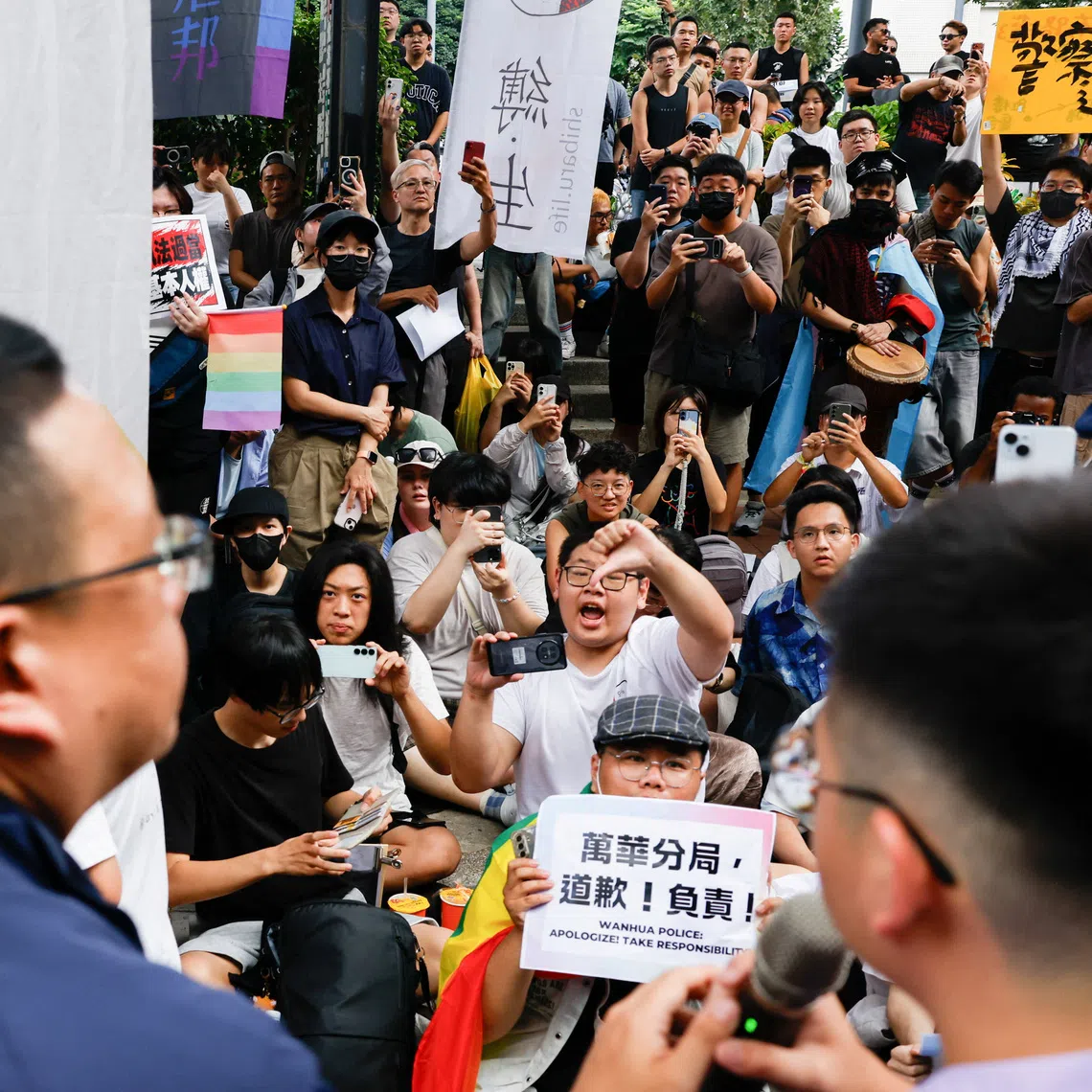 People protest after police raided a gay bar ahead of the annual Taiwan Pride parade later in October.