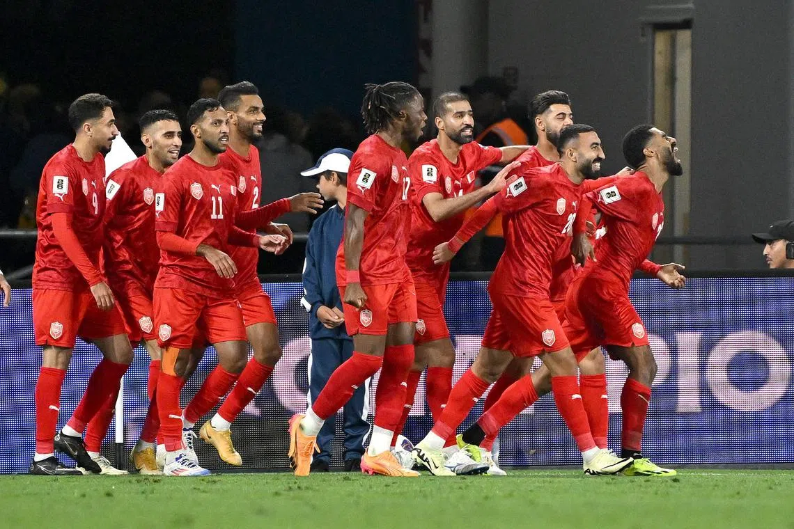 Bahrain defender Abdulla Al-Khulasi (right) celebrating after helping his side to a 1-0 victory over Australia, their first in eight attempts, in their 2026 World Cup qualifier on the Gold Coast on Sept 5.