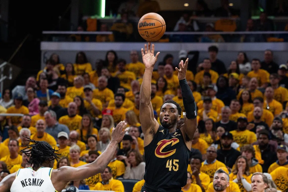 Cleveland Cavaliers guard Donovan Mitchell shooting the ball while Indiana Pacers forward Aaron Nesmith defends him during Game 3 of the Eastern Conference semi-finals at Gainbridge Fieldhouse on May 9. The Cavs won 126-104.