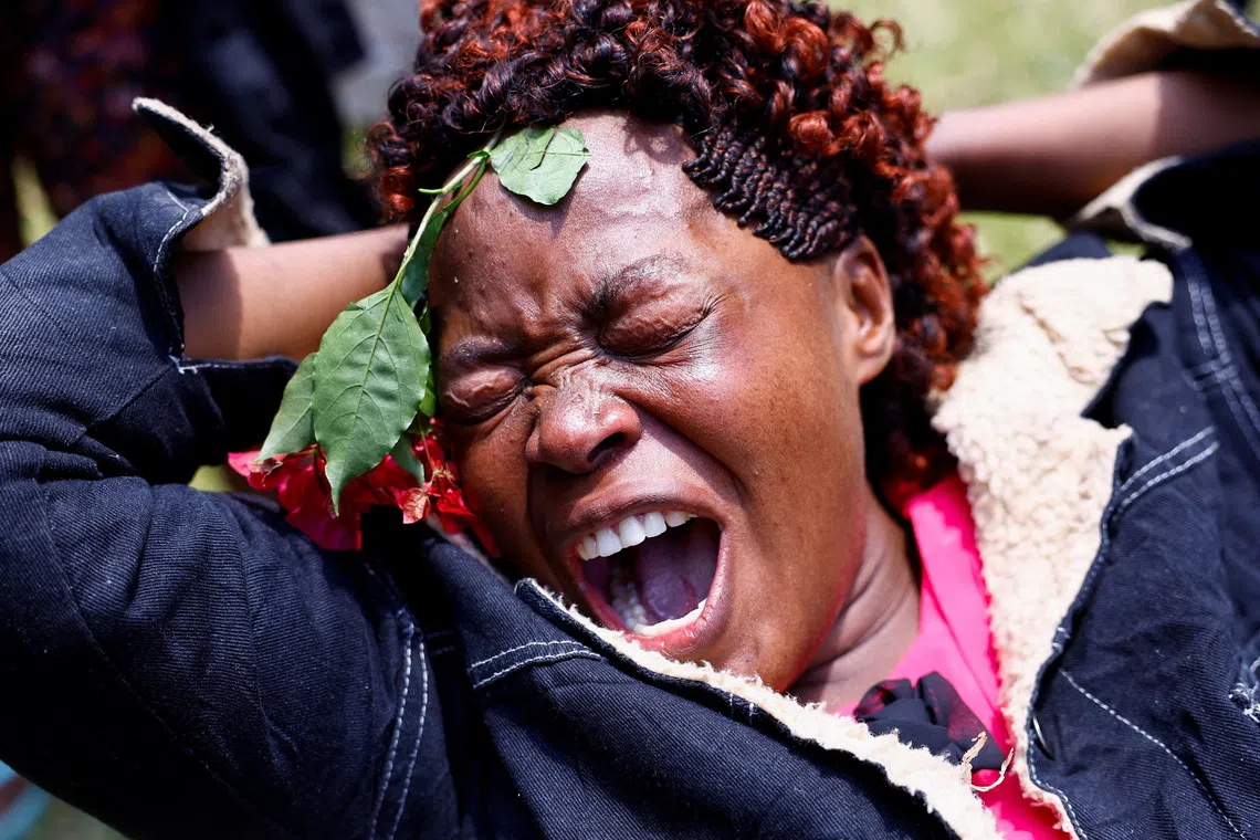 A woman reacting as she mourns the death of former Kenyan Prime Minister Raila Odinga, at his Karen residence in the outskirts of Nairobi, Kenya, on Oct 15, 2025.