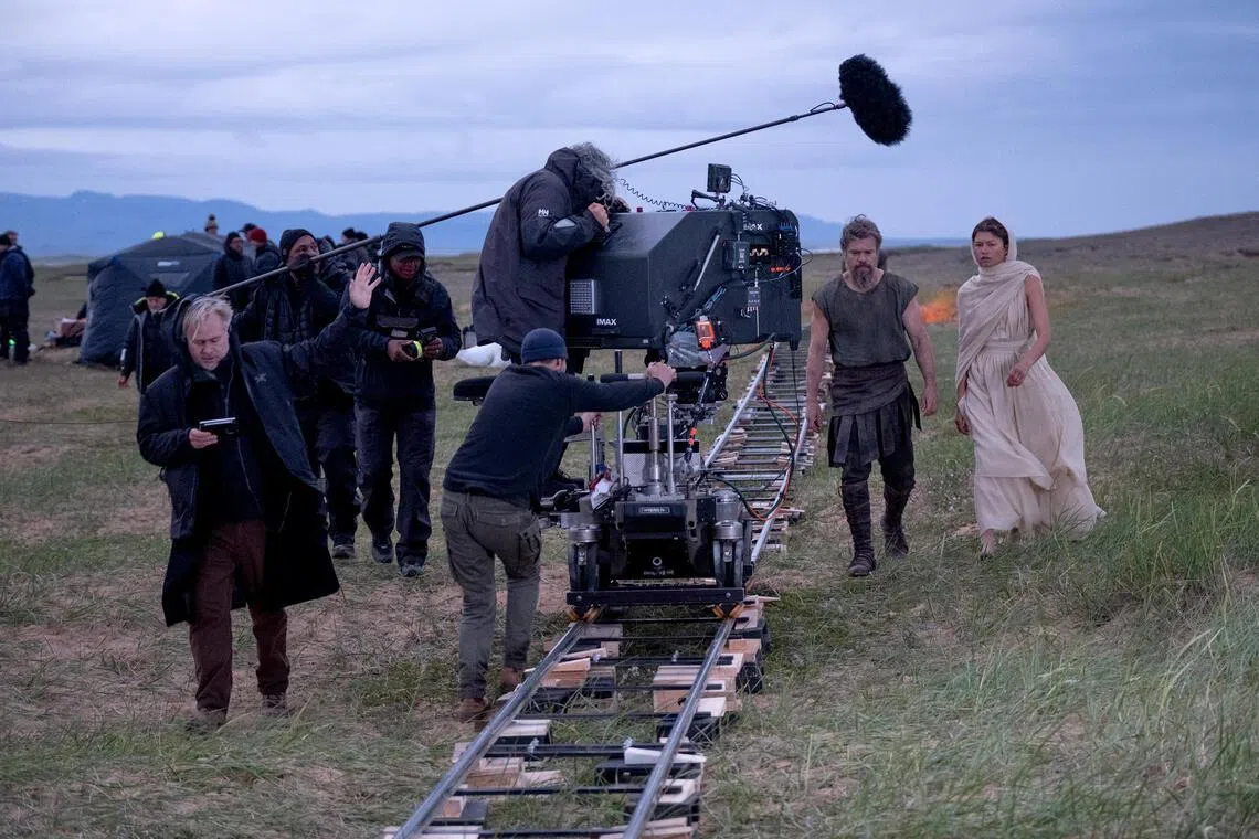 Christopher Nolan (far left) with actors Zendaya (right) and Matt Damon. The film-maker shot the entire film with IMAX film cameras.