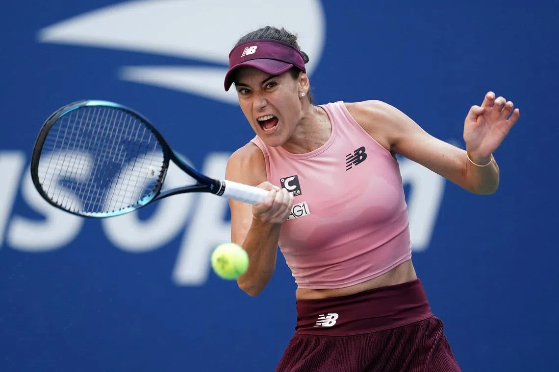 Sorana Cirstea of Romania returns to Belinda Bencic of Switzerland during their fourth round match.