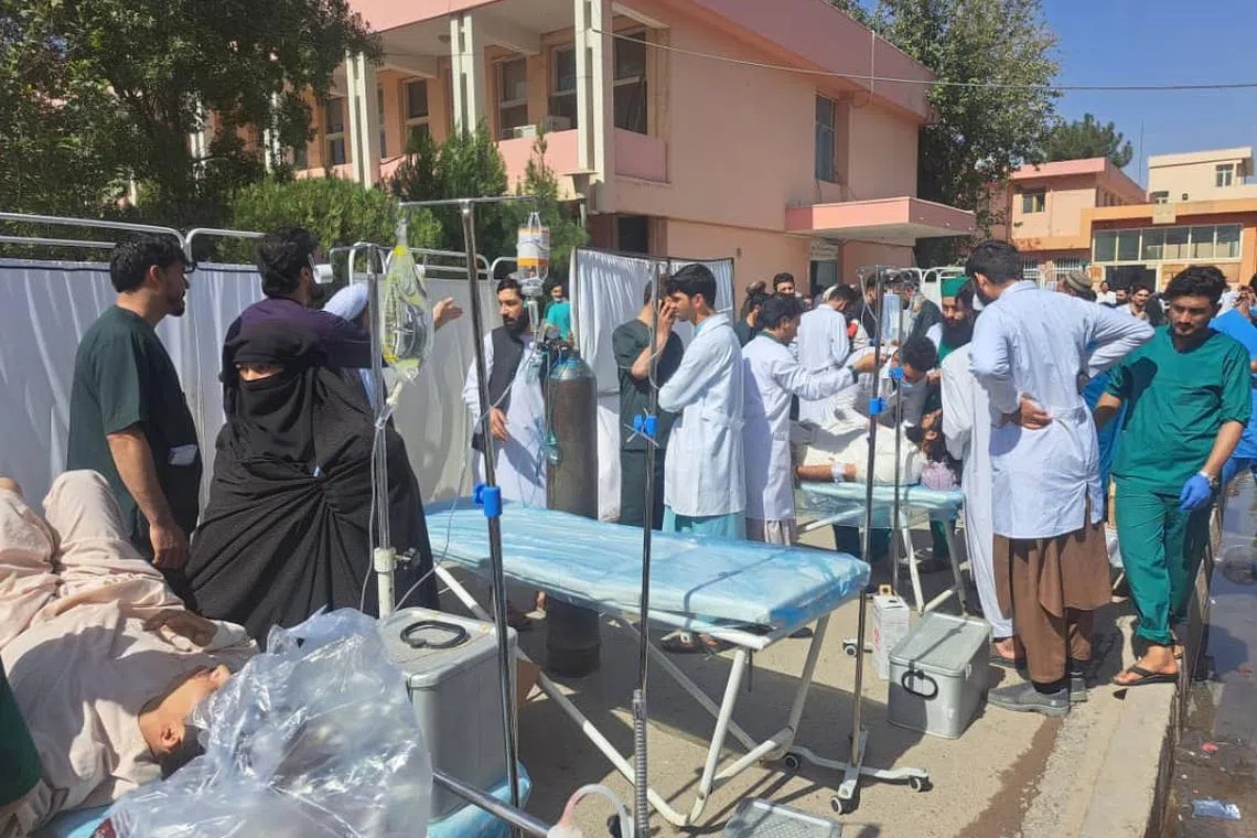 Crowds of residents fled buildings in Herat at around 11am (2.30pm SIngapore time) as the quakes began.