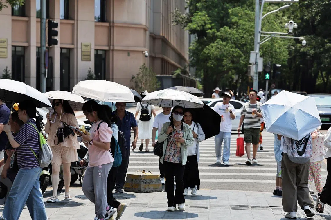 Hot weather on June 24, 2025 with a temperature of 38 Degree celsius at Wangfujing Pedestrian Street in Beijing, China.