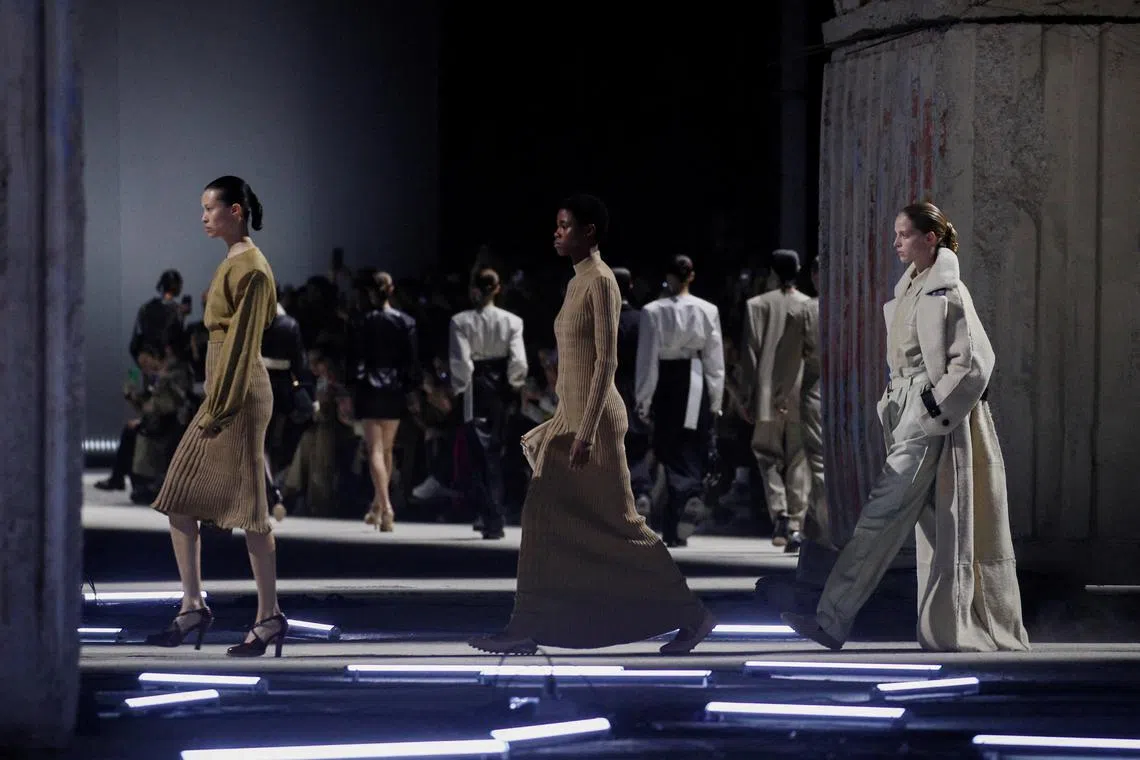 Models present creations from the Tod's Fall/Winter 2023/2024 collection during Fashion Week in Milan.