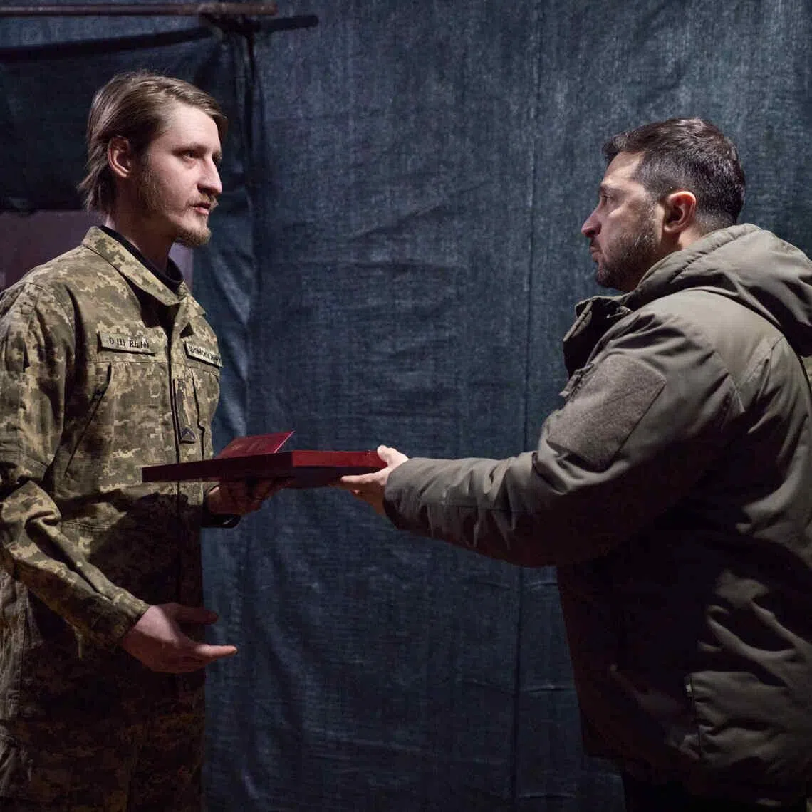 Ukrainian President Volodymyr Zelensky presenting awards to troops in Druzhkivka – a town that lies about 15km from the front with invading Russian troops.