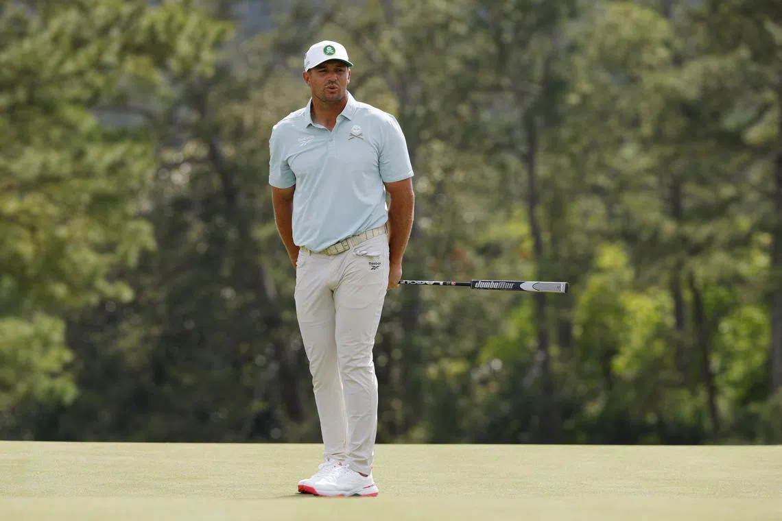 Golf - The Masters - Augusta National Golf Club, Augusta, Georgia, U.S. - April 11, 2025 Bryson DeChambeau of the U.S. reacts after a missed putt on the green on the 18th hole during the second round REUTERS/Brian Snyder