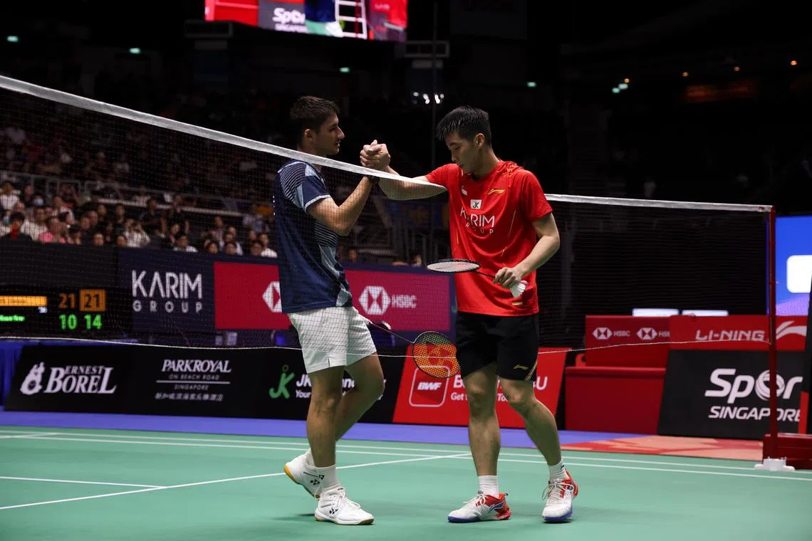 Singapore's Loh Kean Yew (rigt) lost 21-10, 21-14 to Frenchman Christo Popov in the KFF Singapore Open men's singles quarter-final at the Singapore Indoor Stadium on May 30.