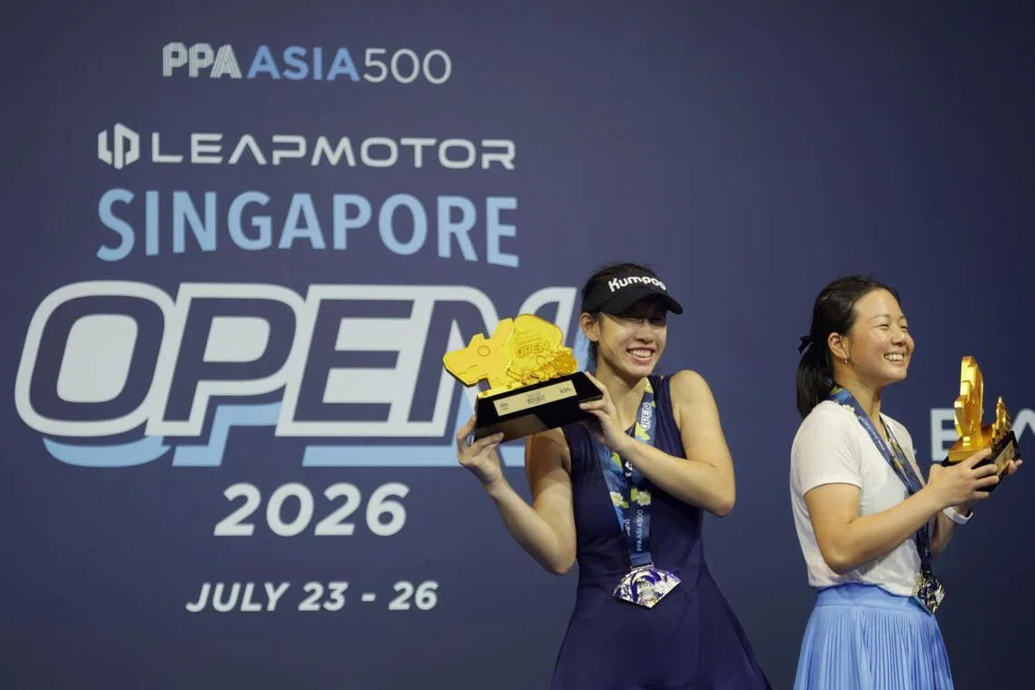 ST20260726_202645600161/Jasel Poh/mtpickle26

Wheatley Long Yufei and K. Wheatley posing with their trophies after winning the Pro Women's doubles final at the PPA Tour Asia 500 Leapmotor Singapore Open on Jul 26, 2026.

ST PHOTO: JASEL POH