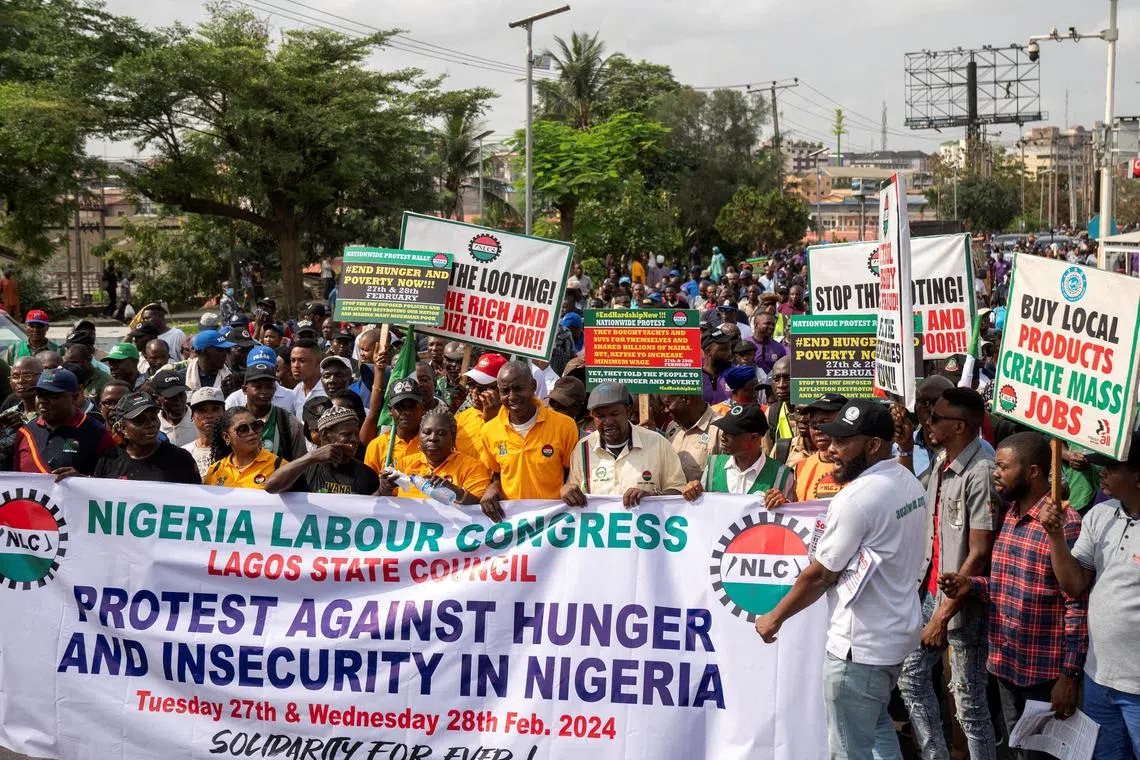 FILE PHOTO: Nigeria Labor Congress (NLC) protest against the high cost of living and massive suffering following a hike in petrol and devaluation of the Naira in Lagos, Nigeria February 27, 2024. REUTERS/Marvellous Durowaiye/File Photo